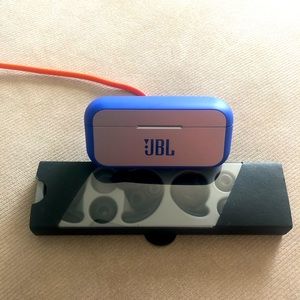 JBL wireless earbuds with charging case, charging cord and multiple earbud sizes